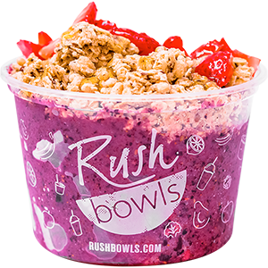 Dark purple smoothie bowl with yummy berry toppings. 