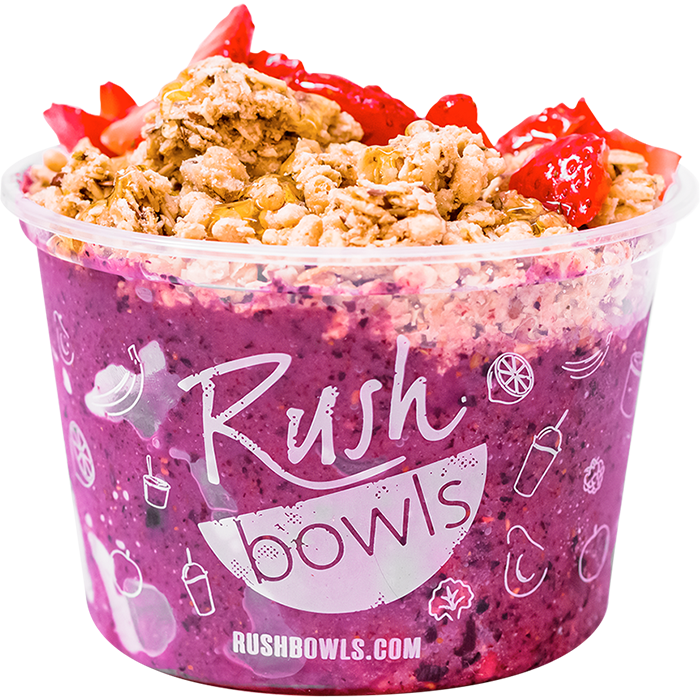 Dark purple smoothie bowl with yummy berry toppings. 