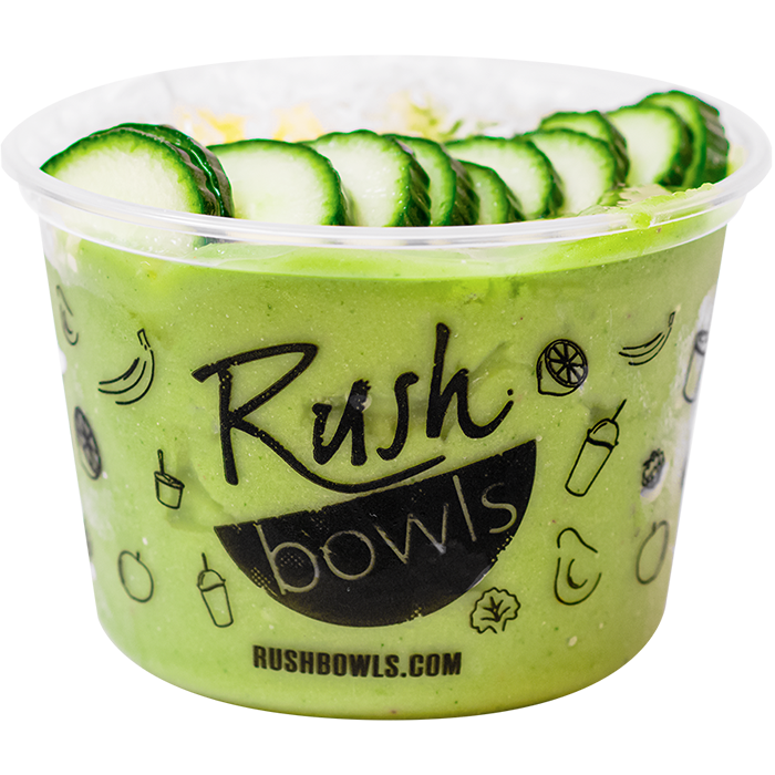 Green smoothie bowl with cucumber, avocado, kale, and peach flavoring with yummy toppings. 