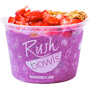 Purple smoothie bowl with flavors of blueberry, raspberry, banana, and much more. 